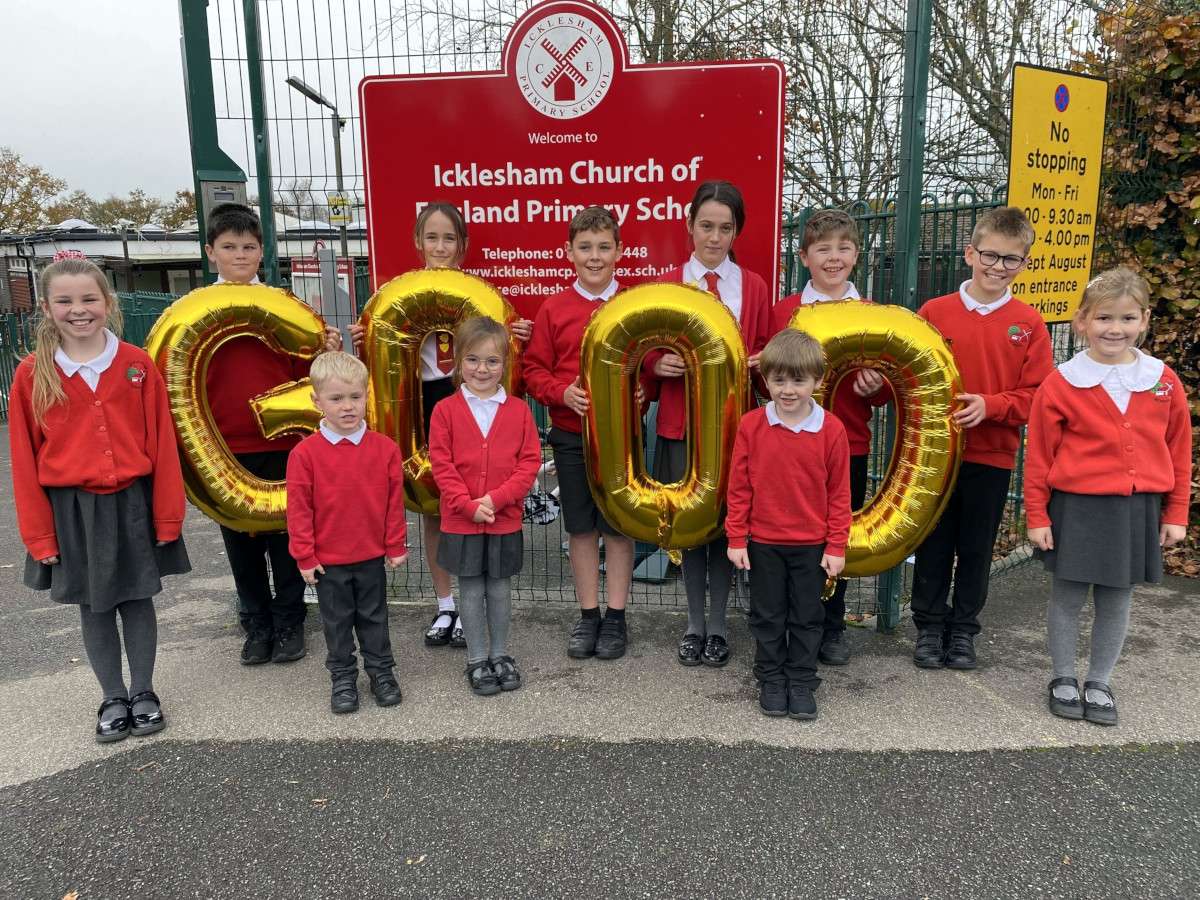 Children celebrating with 'Good' balloons.