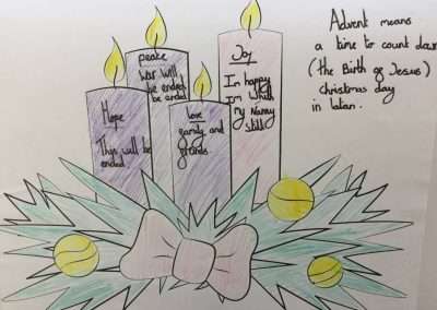 Advent candles with festive decorations.